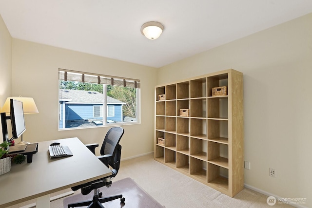 office space featuring baseboards and carpet floors