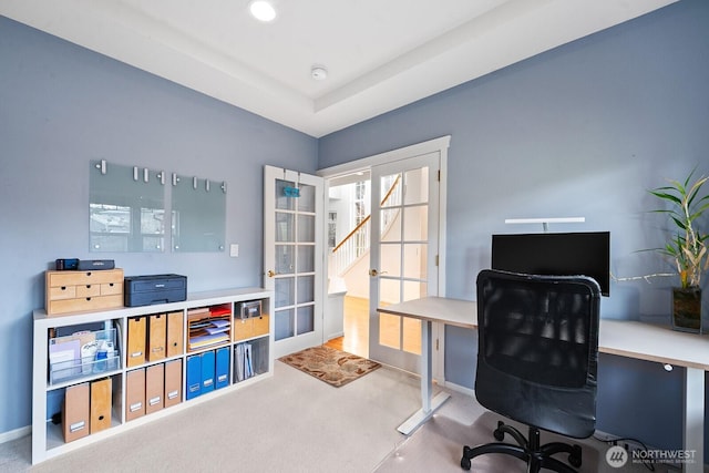 carpeted office featuring french doors and baseboards