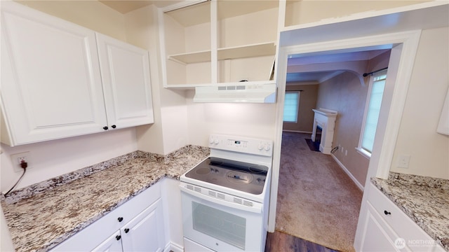 kitchen featuring white electric stove, light stone counters, under cabinet range hood, and white cabinets