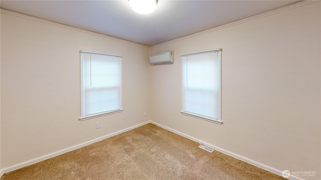 empty room with visible vents, baseboards, carpet, and an AC wall unit