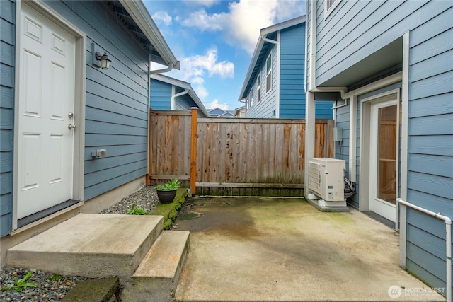 view of patio / terrace featuring fence and ac unit