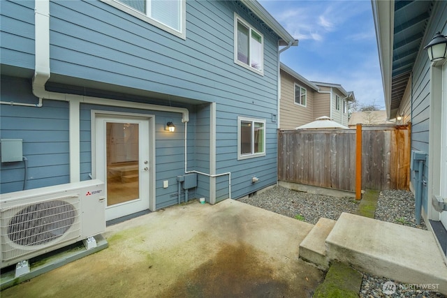 view of patio / terrace featuring ac unit and fence