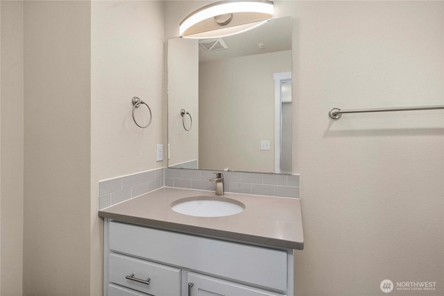 bathroom featuring vanity and visible vents