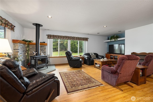 6084 Gartin Pl, Sedro Woolley, WA 98284 - living room with recessed lighting, wood finished floors, and a wood stove