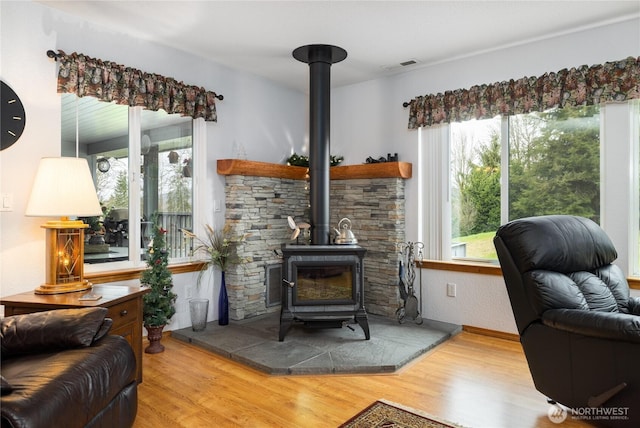 6084 Gartin Pl, Sedro Woolley, WA 98284 - living room with visible vents, wood finished floors, and a wood stove