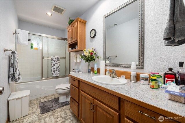 6084 Gartin Pl, Sedro Woolley, WA 98284 - bathroom with vanity, toilet, visible vents, and shower / bath combination with glass door