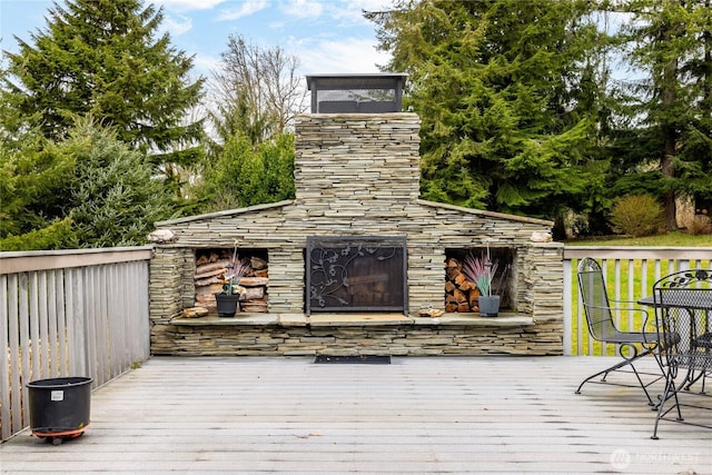 6084 Gartin Pl, Sedro Woolley, WA 98284 - wooden deck featuring an outdoor stone fireplace