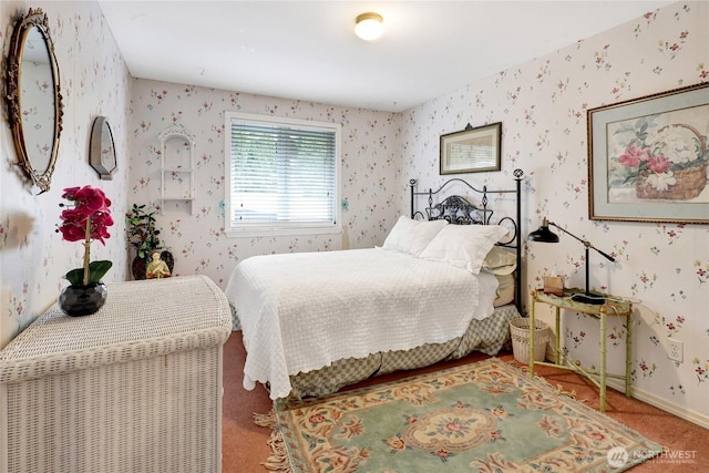 bedroom featuring baseboards, carpet, and wallpapered walls