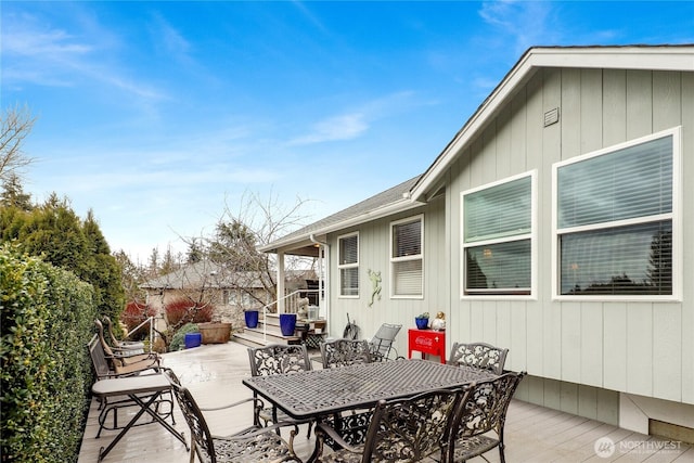 view of patio / terrace with outdoor dining area and a deck