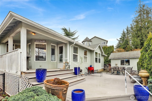 back of house with outdoor dining area