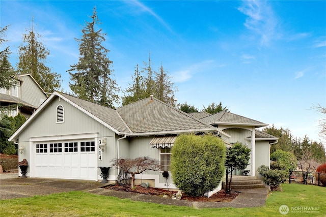 view of front of home featuring driveway and an attached garage