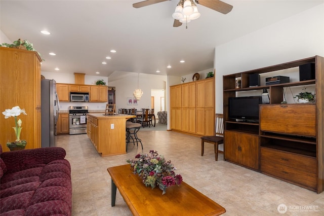 living area featuring recessed lighting and a ceiling fan