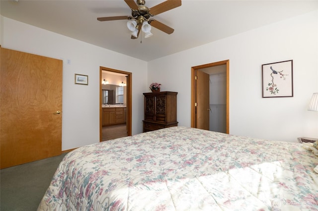 bedroom featuring ceiling fan, ensuite bath, and carpet flooring