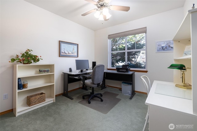 carpeted home office with baseboards and ceiling fan