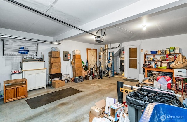 garage featuring electric panel, water heater, and a garage door opener