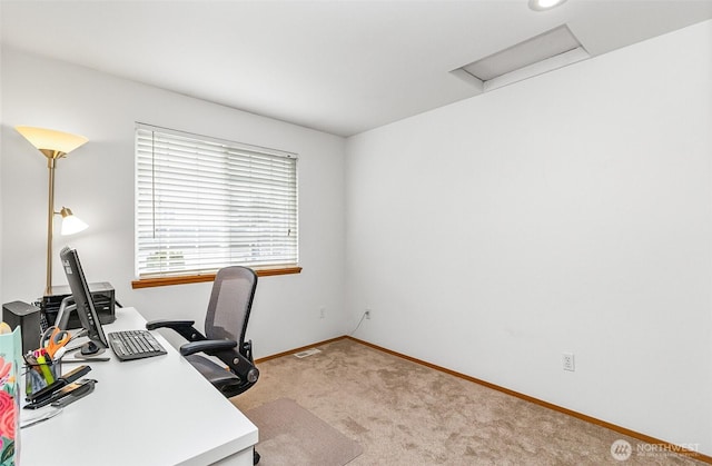 office with attic access, visible vents, baseboards, and light carpet