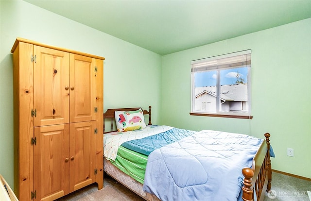 bedroom with carpet and baseboards