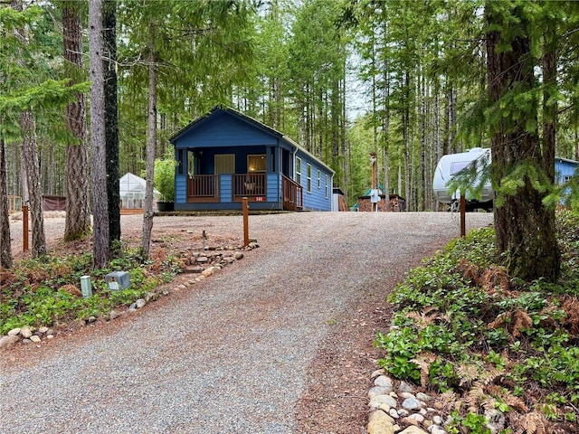 view of front of home featuring a porch and driveway