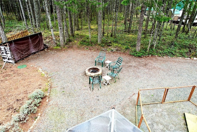 view of yard with a fire pit