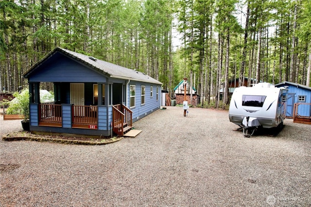 view of front of home with a porch and driveway