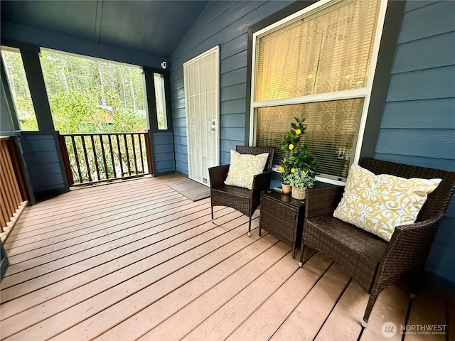 wooden terrace featuring covered porch