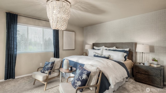 bedroom featuring baseboards, a chandelier, and carpet flooring