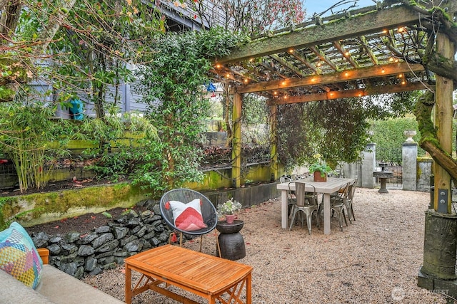 view of patio / terrace featuring outdoor dining space, fence, and a pergola