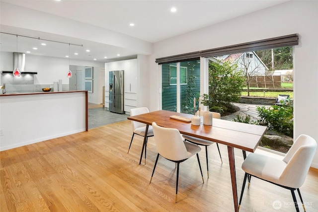 dining room featuring recessed lighting and light wood-style floors