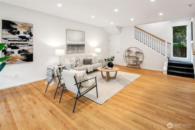 living area featuring recessed lighting, stairway, baseboards, and wood finished floors