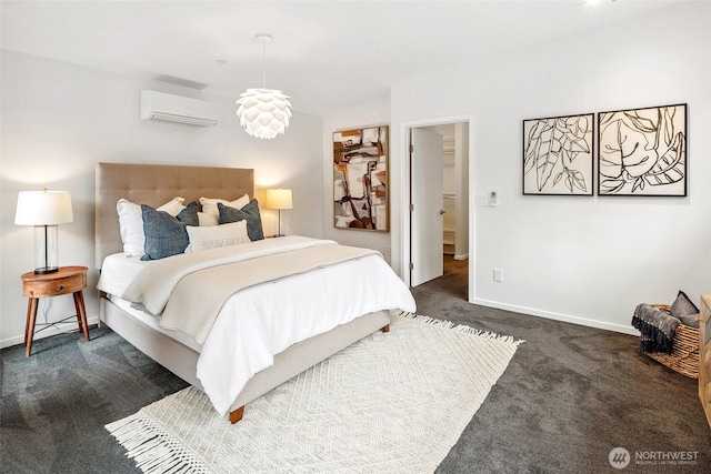 carpeted bedroom featuring baseboards and a wall mounted air conditioner