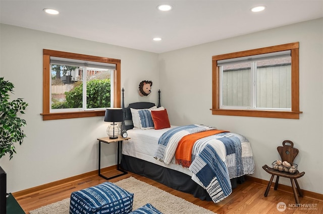 bedroom featuring recessed lighting, baseboards, and wood finished floors