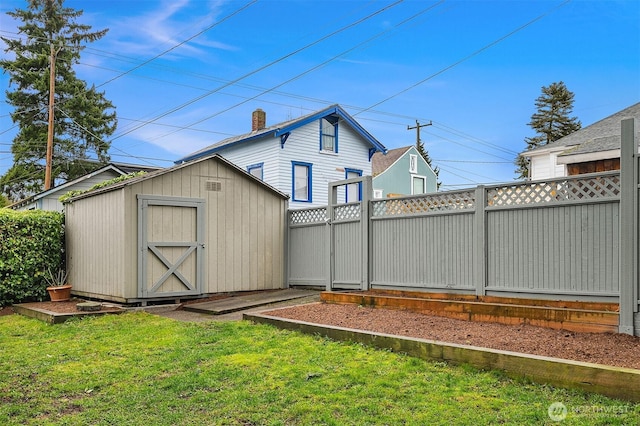 view of shed with fence