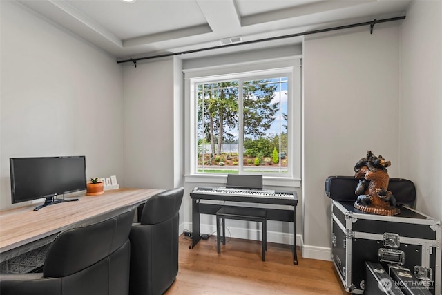 office area featuring baseboards and light wood-style floors