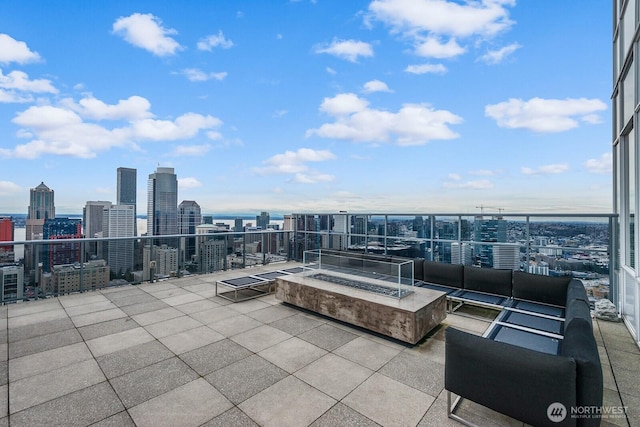 view of patio / terrace with an outdoor living space and a view of city