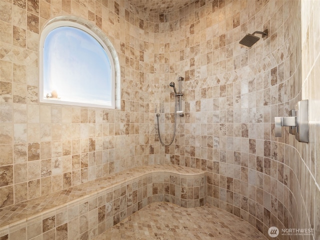 full bath featuring tiled shower