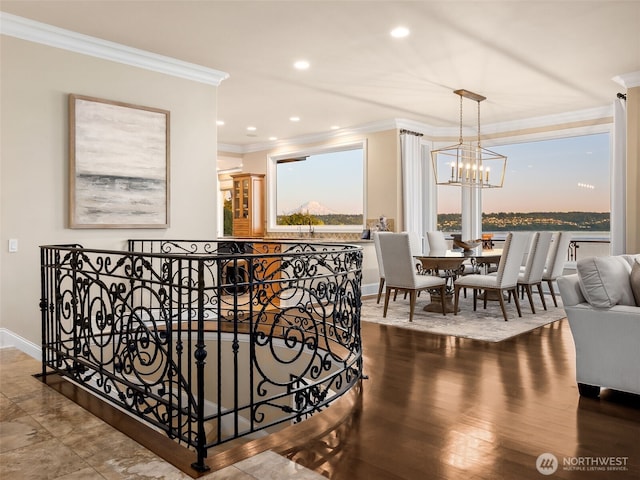 hallway featuring crown molding, a notable chandelier, recessed lighting, and baseboards