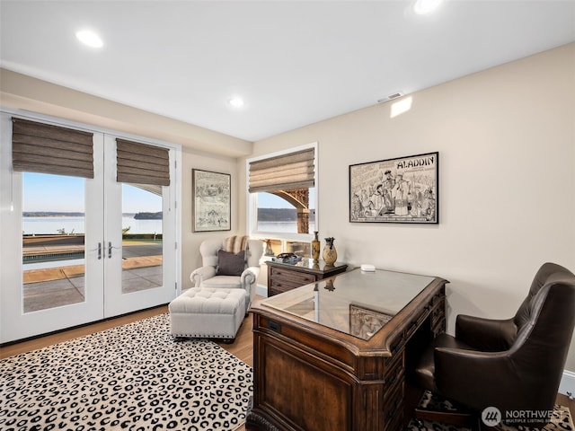 office featuring recessed lighting, wood finished floors, visible vents, and french doors