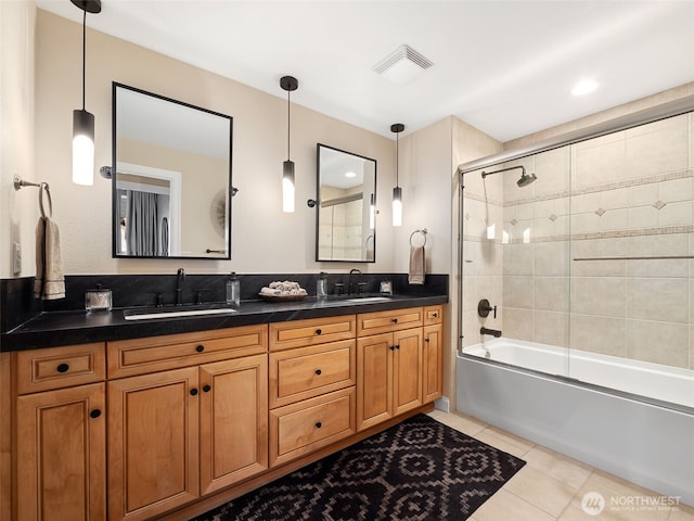 full bath featuring tile patterned floors, double vanity, visible vents, and a sink