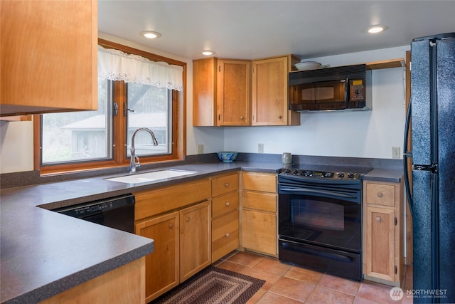 239 Shoreland Dr, Lopez Island, WA 98261 - kitchen with black appliances, a sink, dark countertops, recessed lighting, and light tile patterned floors
