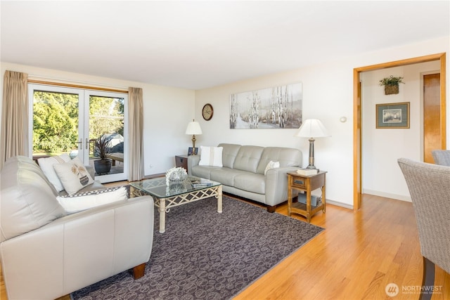 living room with light wood finished floors and baseboards