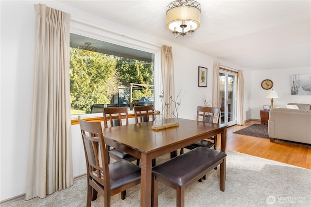 dining area with light wood-style flooring