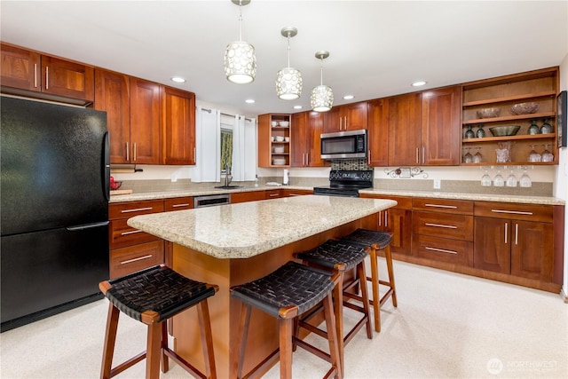 kitchen with a kitchen island, decorative light fixtures, a breakfast bar area, black appliances, and open shelves