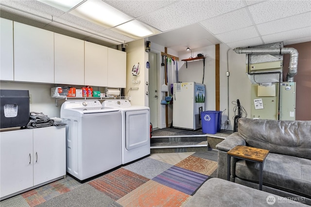 washroom featuring cabinet space and washer and dryer