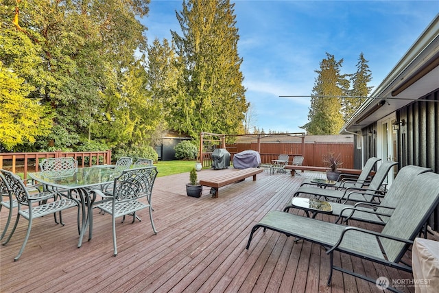 deck featuring outdoor dining area