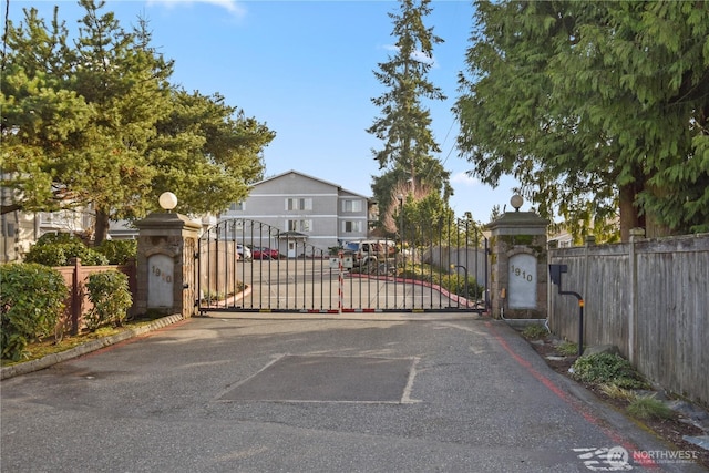 view of gate featuring fence