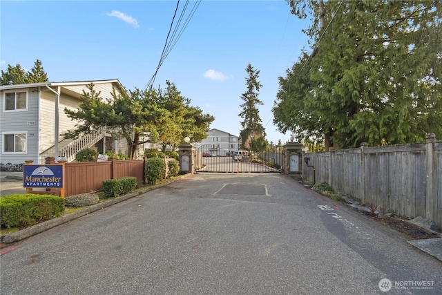 view of street with a gated entry and a gate