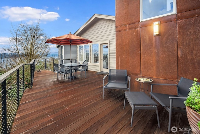 deck featuring outdoor dining area