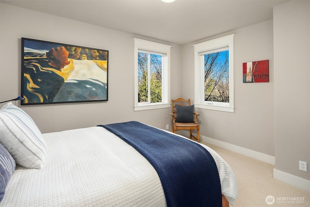 carpeted bedroom featuring baseboards