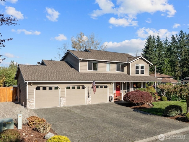 view of front of property featuring aphalt driveway, a garage, a shingled roof, and fence