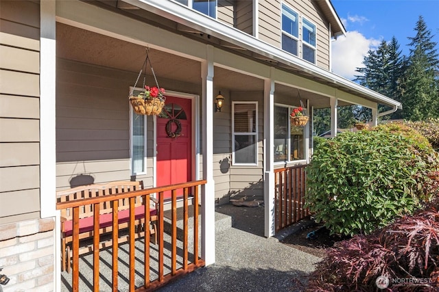 doorway to property featuring covered porch